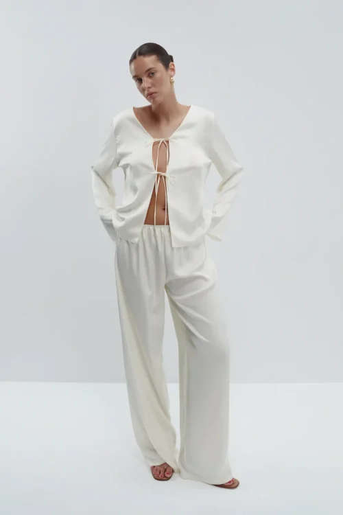Satin pants with a thin pearl belt